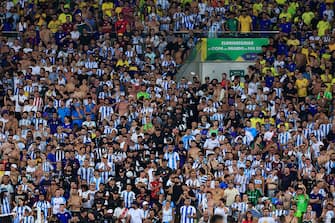 RIO DE JANEIRO, BRAZIL - NOVEMBER 21: Police officers stand next to fans during a FIFA World Cup 2026 Qualifier match between Brazil and Argentina at Maracana Stadium on November 21, 2023 in Rio de Janeiro, Brazil. (Photo by Buda Mendes/Getty Images)