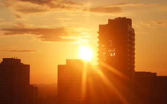 Golden moments of sunrise at Summer Solstice June 20, 2020 as seen on cityscapes of the city of Toronto.