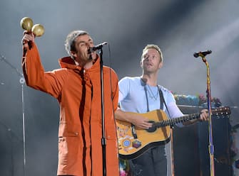 MANCHESTER, ENGLAND - JUNE 04:  Liam Gallagher (L) and Chris Martin of Coldplay perform on stage during the One Love Manchester Benefit Concert at Old Trafford Cricket Ground on June 4, 2017 in Manchester, England.  (Photo by Kevin Mazur/One Love Manchester/Getty Images for One Love Manchester)
