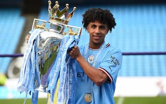 epa10644628 Rico Lewis of Manchester City poses with the English Premier League trophy after the English Premier League match between Manchester City and Chelsea FC in Manchester, Britain, 21 May 2023.  EPA/PETER POWELL EDITORIAL USE ONLY. No use with unauthorized audio, video, data, fixture lists, club/league logos or 'live' services. Online in-match use limited to 120 images, no video emulation. No use in betting, games or single club/league/player publications.