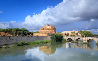 Tiber River in Rome, Italy: view of Castle of the Holy Angel (Castel Sant'Angelo) and bridge Ponte Sant'Angelo.