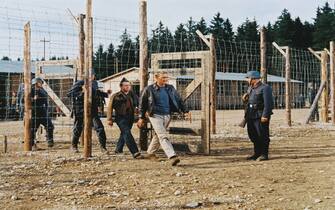 Steve McQueen (1930-1980), US actor, being marched through a gate by German guards in a publicity still issued for the film, 'The Great Escape', 1963. The prisoner of war drama, directed by John Sturges (1910-1992), starred McQueen as 'Captain Virgil 'The Cooler King' Hilts'. (Photo by Silver Screen Collection/Getty Images)