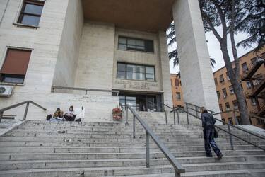 A pedestrian walks steps at the La Sapienza University campus, following a nationwide shutdown of its schools until March 15, in Rome, Italy, on Thursday, March 5, 2020. The coronavirus outbreak threatens to plunge Italy and France into a recession and, if it were to last, could ignite a vicious circle of declining markets, the European Commission warned. Photographer: Giulio Napolitano/Bloomberg via Getty Images