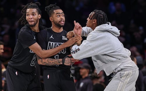 Feb 4, 2025; Brooklyn, New York, USA; Brooklyn Nets guard D'Angelo Russell (1) celebrates with teammates after making the game-winning three point basket with 3.1 seconds remaining in the fourth quarter to defeat the Houston Rockets at Barclays Center. Mandatory Credit: Vincent Carchietta-Imagn Images/Sipa USA