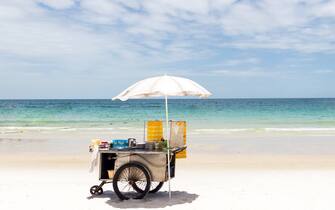 Cart selling roti snack on the beautiful beach in sunny day; popular street snack in Thailand