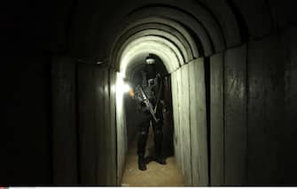 A member of the Ezzedine al-Qassam Brigades, the military wing of the Palestinian Islamist movement Hamas, walks inside a tunnel used for military exercises during a weapon exhibition at a Hamas-run youth summer camp, in Gaza City, on July 21, 2016. Photo by Ashraf Amra//APAIMAGES_092723/Credit:APA IMAGES/SIPA/1607220945