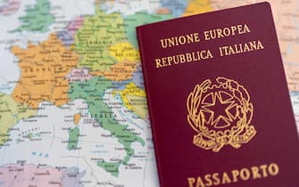 Italian passport with European political map. Close up view