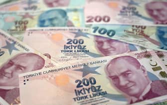 A picture taken on December 7, 2021 in Istanbul shows Turkish lira banknotes. - Turkey's annual inflation rate jumped over 20 percent in November, official data showed  on December 3, 2021, after a currency crisis last month in which the Turkish lira hit record lows against the dollar. (Photo by Ozan KOSE / AFP) (Photo by OZAN KOSE/AFP via Getty Images)