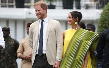 Britain's Prince Harry (2ndR), Duke of Sussex, and  Britain's Meghan (R), Duchess of Sussex, react as Lagos State Governor, Babajide Sanwo-Olu (unseen), gives a speech at the State Governor House in Lagos on May 12, 2024 as they visit Nigeria as part of celebrations of Invictus Games anniversary. (Photo by Kola SULAIMON / AFP) (Photo by KOLA SULAIMON/AFP via Getty Images)