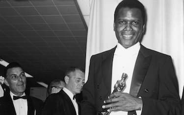13th April 1964, American actor Sidney Poitier holds his Best Actor Oscar for director Ralph Nelson's film 'Lilies of The Field' backstage at the Academy Awards ceremony in Santa Monica, California (Photo by Archive Photos/Getty Images)