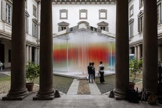 MILAN, ITALY - APRIL 15: Three people stand in front of the installation "Straordinaria" by Elica / we+ during the Milan Design Week 2024 at Palazzo Litta on April 15, 2024 in Milan, Italy. Every year, the Salone Internazionale del Mobile and Fuorisalone define the Milan Design Week, the worldâ  s largest annual furniture and design event. Centered on principles of circular economy, reuse, and sustainable practices and materials, the Fuorisaloneâ  s 24 theme:Â â  Materia Naturaâ  , seeks to foster a culture of mindful design. (Photo by Emanuele Cremaschi/Getty Images)