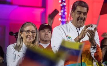 epa11010183 The President of Venezuela Nicolas Maduro (R), accompanied by first lady Cilla Flores (L), participates in a celebration event after the consultative referendum for El Essequibo, in Caracas, Venezuela, 03 December 2023. Maduro announced a new stage in the territorial dispute with Guyana, after the publication of the results of the non-binding referendum held in the country, in which the vast majority of voters supported the proposal to annex the area under dispute to the national map. The referendum concerned the possible creation of a new Venezuelan state in the disputed Essequibo region, a region internationally recognized as belonging to Guyana. Maduro also considered that, with the electoral result, the country has 'taken a big step in the right direction' regarding the 'pending chapter of 150 years of imperial dispossession' of the territory, which Venezuela has not controlled since 1899 and which it now plans to incorporate into its territory, as well as providing identity documents to its inhabitants.  EPA/Miguel Gutierrez
