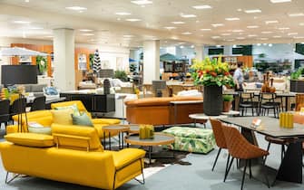 Domayne Harvey Norman furniture store interior, leather yellow sofa on display, furniture and homewares, Sydney,Australia,2022