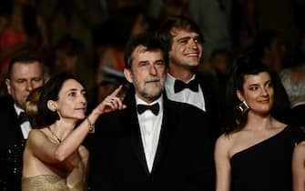 Italian actress Elena Lietti (L), Italian director Nanni Moretti (C) and Italian actress Arianna Pozzoli arrive for the screening of the film "Il Sol Dell'Avvenire" (A Brighter Tomorrow) during the 76th edition of the Cannes Film Festival in Cannes, southern France, on May 24, 2023. (Photo by LOIC VENANCE / AFP) (Photo by LOIC VENANCE/AFP via Getty Images)