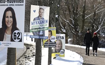 Election posters of The National Coalition Party (L and 2ndL) and of The Finns Party and its leader Riikka Purra (R) are displayed in Espoo, Finland, on March 29, 2023, ahead of the Finnish 2023 parliamentary elections on April 2, 2023. (Photo by Heikki Saukkomaa / Lehtikuva / AFP) / Finland OUT (Photo by HEIKKI SAUKKOMAA/Lehtikuva/AFP via Getty Images)