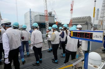 epa10760365 Journalists visit Tokyo Electric Power Company's (TEPCO) Fukushima Daiichi Nuclear Power Plant in Okuma, Fukushima Prefecture, northern Japan, 21 July 2023, to get hint when the TEPCO and Japanese government will start to release the radioactive water treated by the Advanced Liquid Processing System (ALPS) this summer. The nuclear power plant is located in tsunami-devastated towns of Okuma and Futaba.  EPA/KIMIMASA MAYAMA / POOL