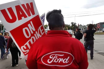 WAYNE, MICHIGAN - SEPTEMBER 26: UAW workers picket outside of Ford's Wayne Assembly Plant on September 26, 2023 in Wayne, Michigan. President Joe Biden traveled to the Detroit area to visit with striking auto workers in Michigan today. Republican presidential candidate former President Donald Trump is expected to hold a rally in nearby Clinton Township tomorrow evening. (Photo by Scott Olson/Getty Images)