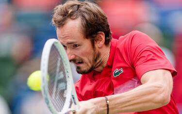 epa11651832 Daniil Medvedev of Russia in action against Jannik Sinner of Italy during their Men's Singles quarter-finals tennis match at the Shanghai Masters tennis tournament in Shanghai, China, 10 October 2024.  EPA/ALEX PLAVEVSKI