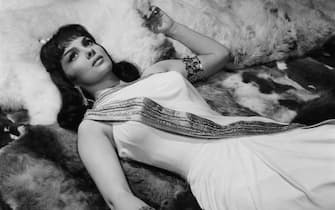Gina Lollobrigida laying down in a scene from the film 'Solomon And Sheba', 1959. (Photo by United Artists/Getty Images)