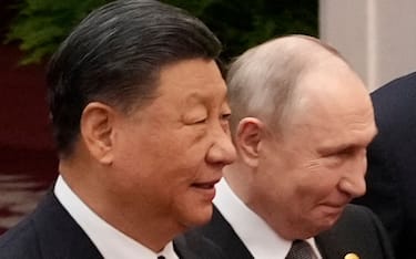 BEIJING, CHINA - OCTOBER 18:  Chinese President Xi Jinping (L) and Russian President Vladimir Putin prepare for a group photo with other leaders at the Third Belt and Road Forum on October 18, 2023 in Beijing, China. (Photo by Suo Takekuma-Pool/Getty Images)