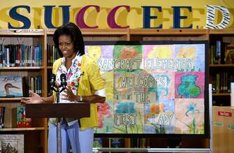 WASHINGTON - MAY 29:  U.S. first lady Michelle Obama speaks to students as she visits Bancroft Elementary School May 29, 2009 in Washington, DC.  The first lady placed a visit to the students who have participated in the White House Kitchen Garden events throughout the spring.  (Photo by Alex Wong/Getty Images)