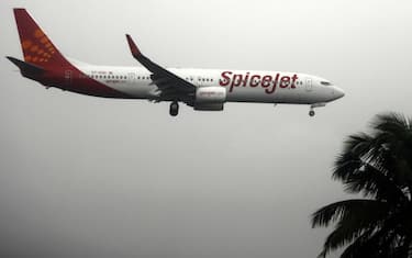 An aircraft from low-cost Indian carrier SpiceJet taxis comes into land at the domestic airport in Mumbai on July 15, 2008.  US-based fund WL Ross said that it will invest 80 million dollars in struggling Indian low-cost airline SpiceJet. SpiceJet shares surged 4.5 rupees, or 16.1 percent, to an intra-day high of 32.45 rupees (76 US cents) following the announcement, but later retreated to close at 28.5 rupees at the Mumbai stock exchange.  The US-based investor is part of global investment manager Invesco, which manages assets for investors in the US, Europe and Asia. Airlines in India, reeling from cut-throat competition in the sector, have also been hard hit by spiralling fuel prices. India has the world's most expensive turbine fuel prices because of local taxes of up to 30 percent. AFP PHOTO/Sajjad HUSSAIN  MORE IN IMAGE FORUM (Photo by Sajjad HUSSAIN / AFP) (Photo by SAJJAD HUSSAIN/AFP via Getty Images)