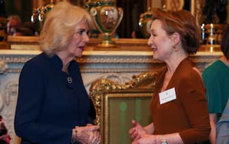 LONDON, ENGLAND - FEBRUARY 18: British Queen Camilla speaks with actress Lesley Manville as she attends a reception for staff, actors and supporters of the National Theatre at Buckingham Palace on February 18, 2025 in London, England. (Photo by Isabel Infantes - WPA Pool/Getty Images)