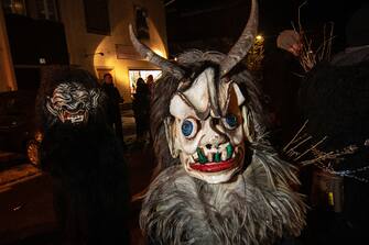 BOLZANO, ITALY - DECEMBER 07: Children dressed as the Krampus creature parade through the city center of Dobbiaco on December 07, 2019 in Bolzano, Italy. (Photo by Simone Padovani/Awakening/Getty Images)