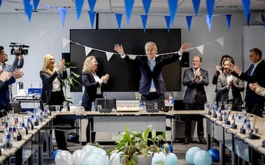 epa10990601 Leader of Freedom party (PVV) Geert Wilders (C-R) gestures next to Dutch MP Fleur Agema (C-L) one day after the House of Representatives elections, The Hague, Netherlands, 23 November 2023. Wilders believes that the PVV can no longer be ignored after the "mega victory" in the House of Representatives elections. He calls on other parties to work together and step over their own shadows. The PVV party is set to win the parliamentary elections with 37 seats after most votes were counted.  EPA/REMKO DE WAAL