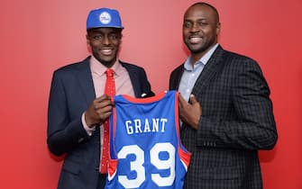PHILADELPHIA, PA - JUNE 28:  Jerami Grant #39 of the Philadelphia 76ers poses for a photo with his father, former NBA player Harvey Grant, after being drafted by the Philadelphia 76ers at the Wells Fargo Center on June 28, 2014 in the Philadelphia, Pennsylvania. NOTE TO USER: User expressly acknowledges and agrees that, by downloading and/or using this photograph, user is consenting to the terms and conditions of the Getty Images License Agreement. Mandatory Copyright Notice: Copyright 2014 NBAE (Photo by Jennifer Pottheiser/NBAE via Getty Images)