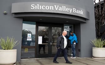 SANTA CLARA, CALIFORNIA - MARCH 10: A man walks by the headquarters of Silicon Valley Bank on March 10, 2023 in Santa Clara, California. (Photo by Liu Guanguan/China News Service/VCG via Getty Images)