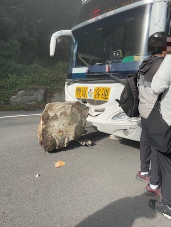 TAICHUNG, TAIWAN - APRIL 3: (----EDITORIAL USE ONLY  MANDATORY CREDIT - 'GUGUAN PUBLIC WORKS SECTION / HANDOUT' - NO MARKETING NO ADVERTISING CAMPAIGNS - DISTRIBUTED AS A SERVICE TO CLIENTS----) Fengyuan Passenger Transport is almost hit by fallin rocks on the Zhonghengbian Road as at least four people were killed and hundreds of others injured after a magnitude 7.4 earthquake struck off Taiwan's eastern coast on the Richter scale, in Taichung, Taiwan on April 3, 2024. Passengers on the bus are still waiting for rescue. (Photo by Guguan Public Works Section/Anadolu via Getty Images)