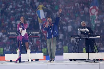 epa11478463 (L-R) German singer Leony, American singer Ryan Tedder of One Republic, and Italian artist Madwill of MEDUZA perform during the closing ceremony ahead of the UEFA EURO 2024 final soccer match between Spain and England, in Berlin, Germany, 14 July 2024.  EPA/CHRISTOPHER NEUNDORF