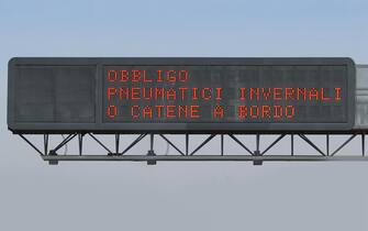 Road signal on Italian language that means Obligation winter equipment or snow chains on board of vehicle