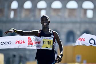 Kenyan runner Asbel Rutto crosses the finish line to win the Rome Marathon, in Rome on March 17, 2024. (Photo by Filippo MONTEFORTE / AFP) (Photo by FILIPPO MONTEFORTE/AFP via Getty Images)