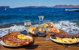 Lunch on the seashore on a wooden table
