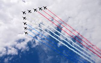 French Air Force elite acrobatic flying team "Patrouille de France" (PAF) performs a fly-over during the Bastille Day military parade on the Champs-Elysees avenue in Paris on July 14, 2023. (Photo by Emmanuel DUNAND / AFP) (Photo by EMMANUEL DUNAND/AFP via Getty Images)