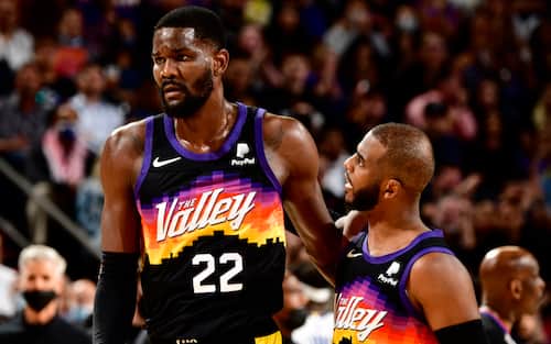 PHOENIX, AZ - NOVEMBER 30: Deandre Ayton #22 and Chris Paul #3 of the Phoenix Suns talk during the game against the Golden State Warriors on November 30, 2021 at Footprint Center in Phoenix, Arizona. NOTE TO USER: User expressly acknowledges and agrees that, by downloading and or using this photograph, user is consenting to the terms and conditions of the Getty Images License Agreement. Mandatory Copyright Notice: Copyright 2021 NBAE (Photo by Barry Gossage/NBAE via Getty Images)
