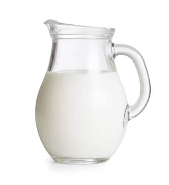 Milk glass jug or jar isolated. Clipping path with no shadows is included.