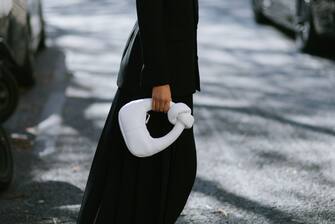 PARIS, FRANCE - OCTOBER 04: Sarah Lysander poses with an Awake white handbag after the Awake show during Paris Fashion Week - Womenswear Spring/Summer 2023 on October 04, 2022 in Paris, France. (Photo by Vanni Bassetti/Getty Images)