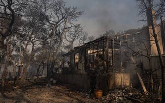 (230721) -- ATHENS, July 21, 2023 (Xinhua) -- A house is destroyed in a wildfire in Agia Sotira, a western suburb of Athens, Greece, on July 20, 2023. For the fourth consecutive day, the wildfires continue to ravage houses and forests in the western part of Athens. (Photo by Lefteris Partsalis/Xinhua) - Lefteris Partsalis -//CHINENOUVELLE_CHINENOUVELLE0132/Credit:CHINE NOUVELLE/SIPA/2307221126