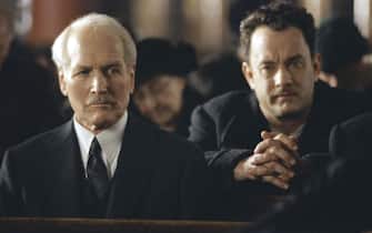 Jul 08, 2002; Los Angeles, CA, USA; Knowing he will be safe within the confines of a church, Michael 
Sullivan (actor TOM HANKS, L) confronts Mr. Rooney (PAUL NEWMAN) in DreamWorks PicturesÕ and Twentieth Century FoxÕs 'Road to Perdition.'
Mandatory Credit: Photo by Francois Duhamel/20th Century Fox/ZUMA Press.
(©) Copyright 2002 by Courtesy of 20th Century Fox