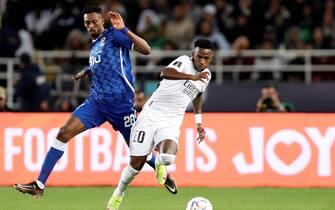 epa10461813 Vinicius Junior (R) of Real Madrid in action against Mohamed Kanno (L) of Al Hilal during the FIFA Club World Cup final between Real Madrid and Al Hilal SFC in Rabat, Morocco, 11 February 2023.  EPA/Mohamed Messara