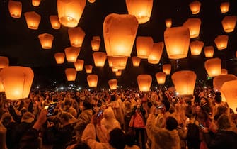 TAIPEI, TAIWAN - FEBRUARY 05: Tourists release sky lanterns during the Pingxi Lantern Festival on February 5, 2023 in Taipei, Taiwan. The Pingxi Lantern Festival has been held for 25 years since 1999. Through years of concerted effort, it has become an internationally renowned festival, attracting many tourists from home and abroad. It has also won many awards, becoming one of the most iconic events in Taiwan. (Photo by Lam Yik Fei/Getty Images)
