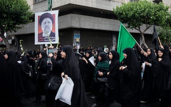 Mandatory Credit: Photo by Sobhan Farajvan/Pacific Press/Shutterstock (14496235e)
Iranian people walk past a portrait of the President Ebrahim Raisi during mourners rally for President Ebrahim Raisi in downtown of Tehran, Iran, on Tuesday, May 21, 2024. President Raisi and the country's foreign minister, Hossein Amirabdollahian, were found dead Monday hours after their helicopter crashed in fog.
Mourners rally for the President Ebrahim Raisi, Tehran, Iran - 21 May 2024