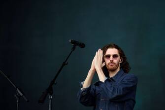 08 September 2019, Berlin: Hozier, musician, folds his hands on a stage at the Lollapalooza Festival in the Olympic Park before beginning his concert. Photo: Gregor Fischer/dpa