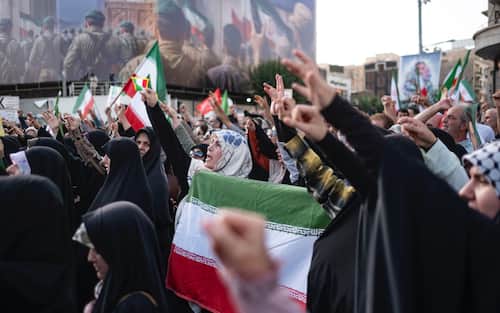 Iranian protesters shout anti-U.S. and anti-Israeli slogans while participating in a protest to condemn the U.S. attacks on Iran's nuclear facilities in downtown Tehran, Iran, on June 22, 2025, amid the Iran-Israel war. (Photo by Morteza Nikoubazl/NurPhoto via Getty Images)