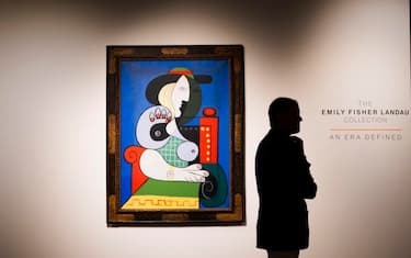 epa10858867 A person stands near the 1932 painting â€˜Femme Ã  la montreâ€™ by Pablo Picasso during a preview of the upcoming Emily Fisher Landau Collection auction at Sothebyâ€™s auction house in New York, New York, USA, 13 September 2023. The Picasso painting, which is expected to sell for over USD 120/ EUR 111.7 million, is among works by Jasper Johns, Willem de Kooning, Robert Rauschenberg, Mark Rothko, Ed Ruscha, and Andy Warhol to be sold at the auction on 08 and 09 November 2023.  EPA/JUSTIN LANE