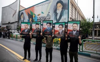 Mandatory Credit: Photo by Sobhan Farajvan/Pacific Press/Shutterstock (14496235l)
Iranian people hold portraits of President Ebrahim Raisi(c) and his four aides during a mourners rally for President Ebrahim Raisi in downtown Tehran, Iran, on Tuesday, May 21, 2024. President Raisi and the country's foreign minister, Hossein Amirabdollahian, were found dead Monday hours after their helicopter crashed in fog.
Mourners rally for the President Ebrahim Raisi, Tehran, Iran - 21 May 2024