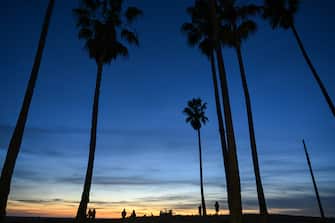 LOS ANGELES, CALIFORNIA - DECEMBER 10: People enjoy at the Venice Beach during sunset as daily life in Pacific coastline of Los Angeles, California, United States on December 10, 2023. (Photo by Tayfun Coskun/Anadolu via Getty Images)